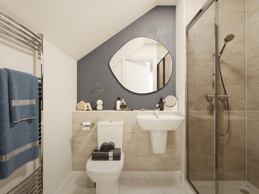 The top floor bedroom features en suite shower room