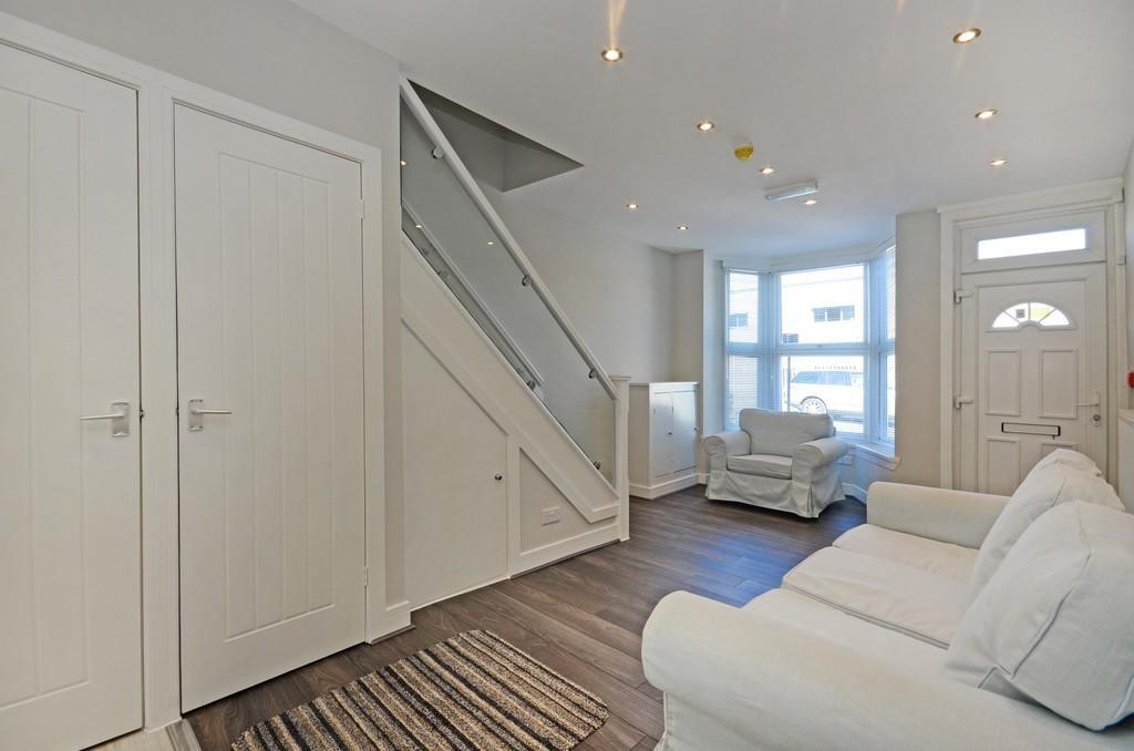 Bright and tidy living room featuring comfortab...