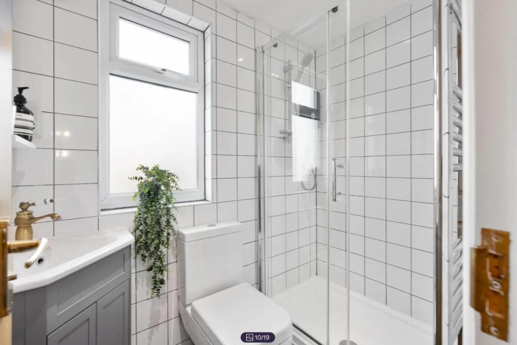 A modern and clean bathroom featuring stylish t...