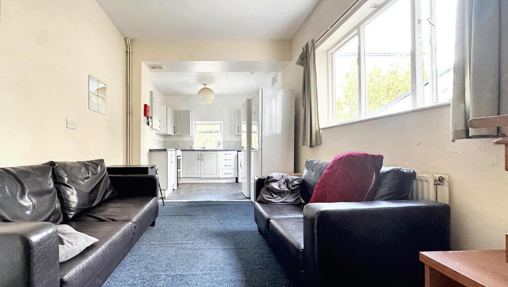 A spacious and inviting living room with large ...