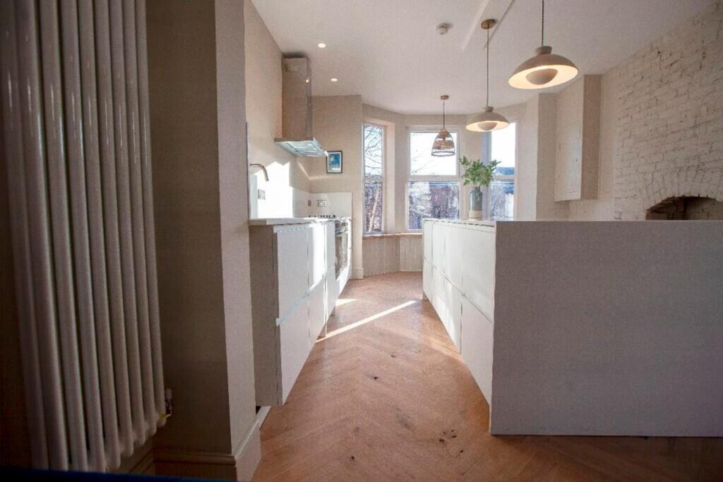 A bright and spacious kitchen featuring modern ...