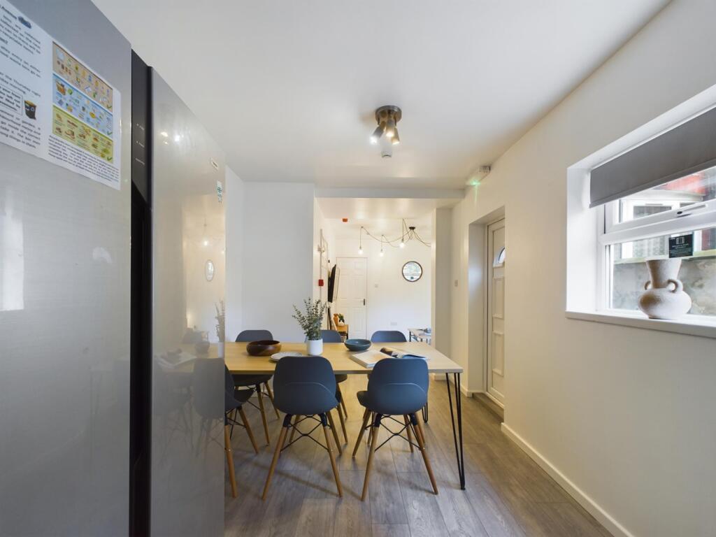 A modern and inviting kitchenette with a spacio...