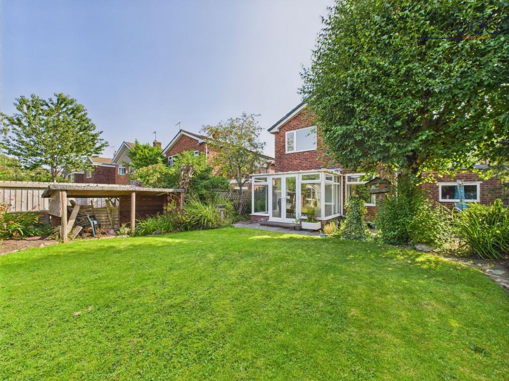 Mature garden with a mix of flags and lawn