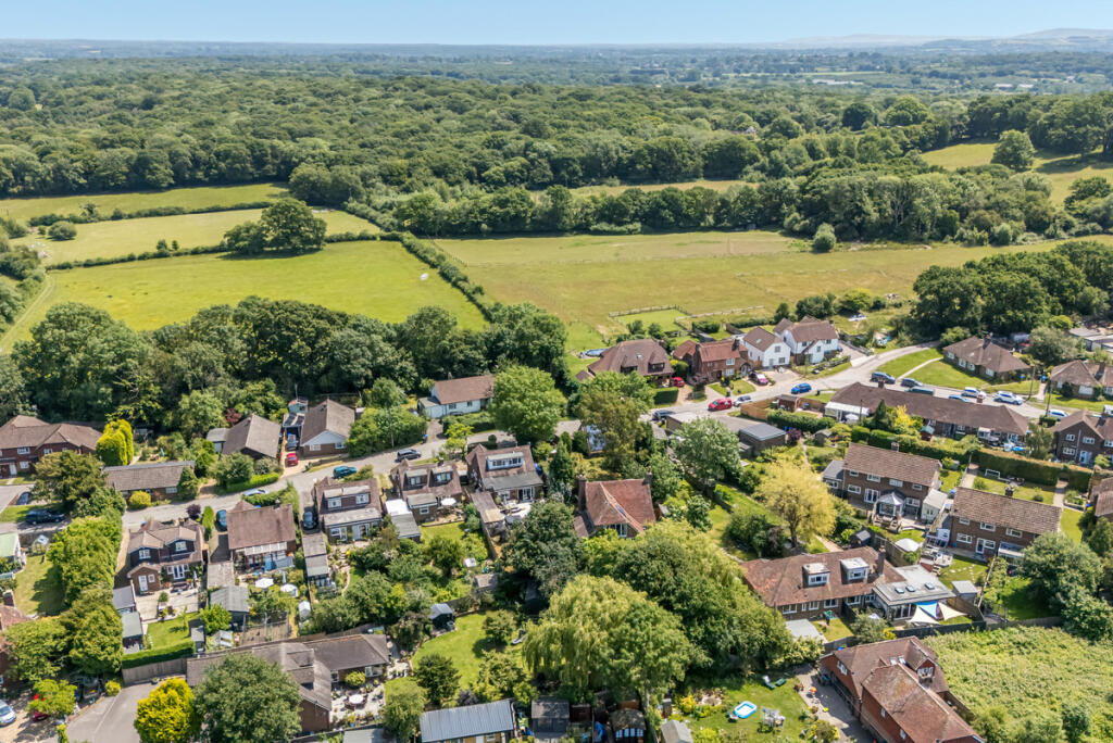 Aerial view of the house and surrounding open countryside