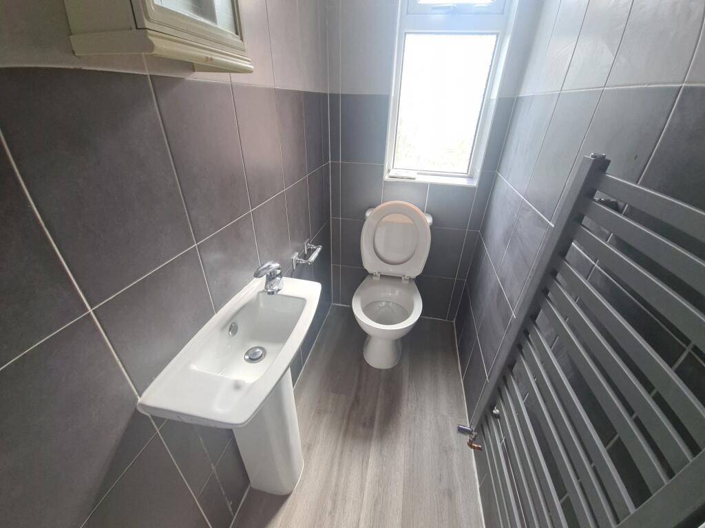 Bright and clean bathroom featuring modern grey...