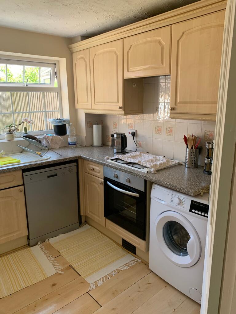 A bright and functional kitchen featuring moder...