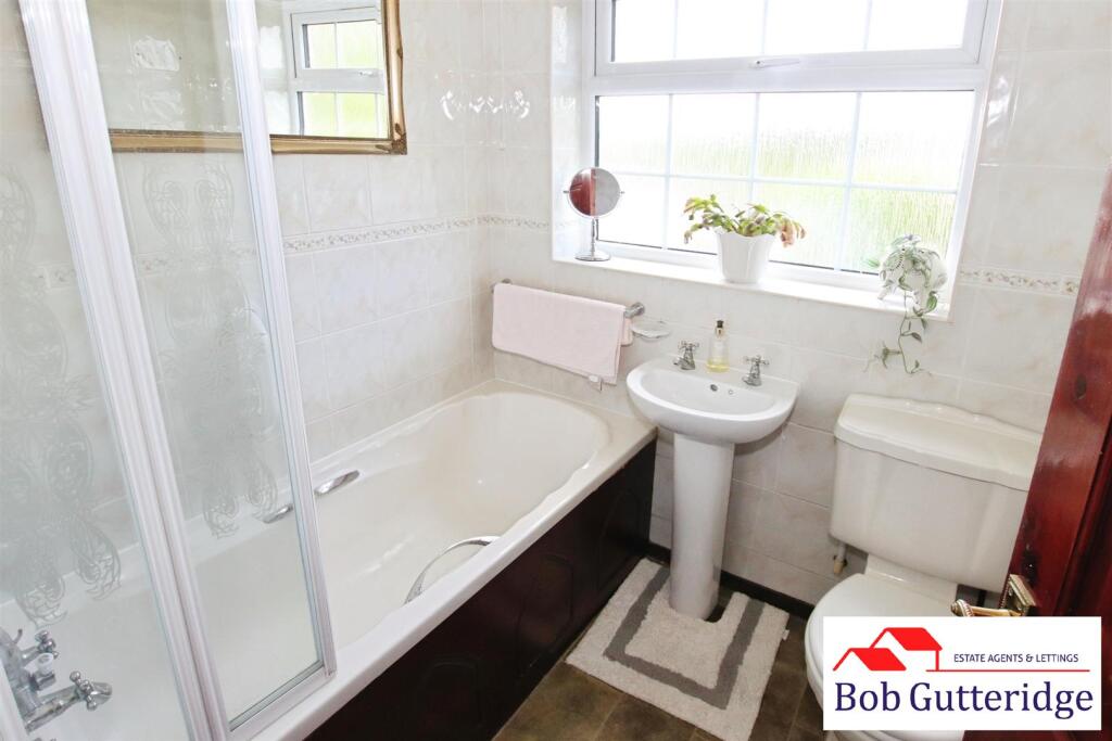 FULLY TILED BATHROOM