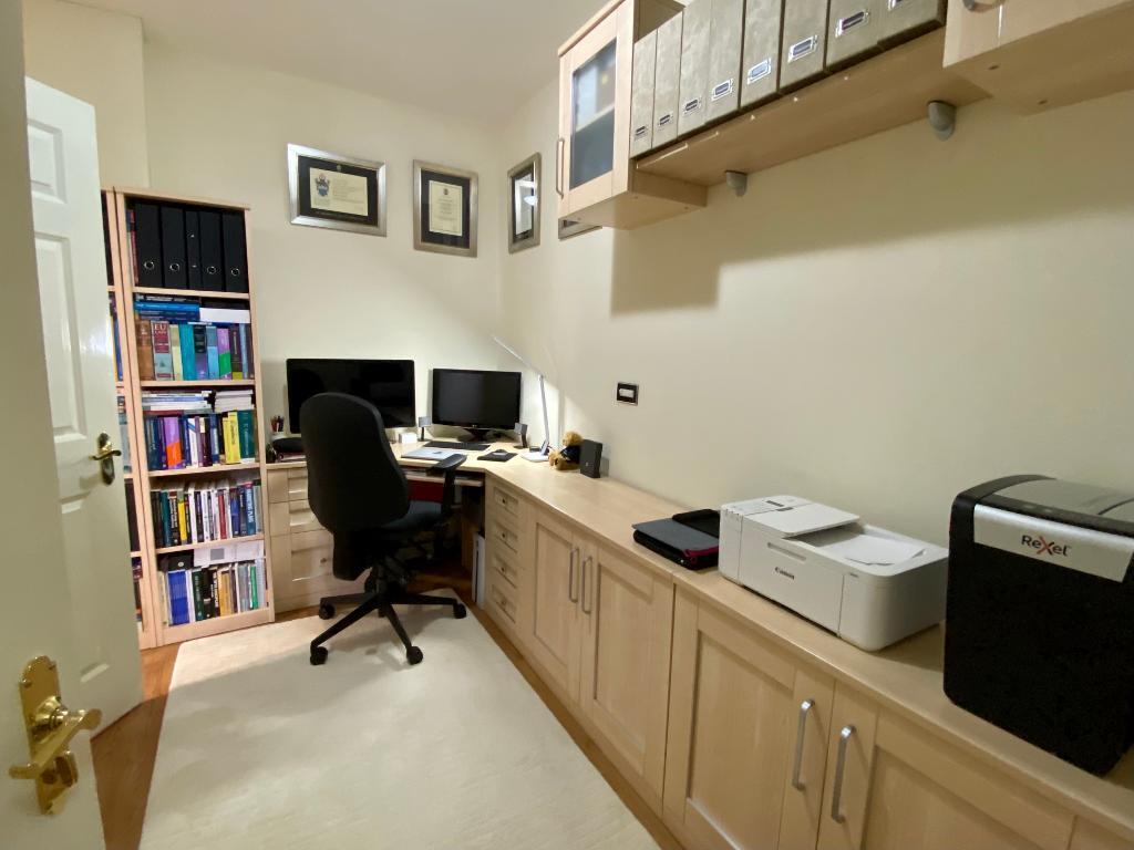 Office with fitted desk and furniture