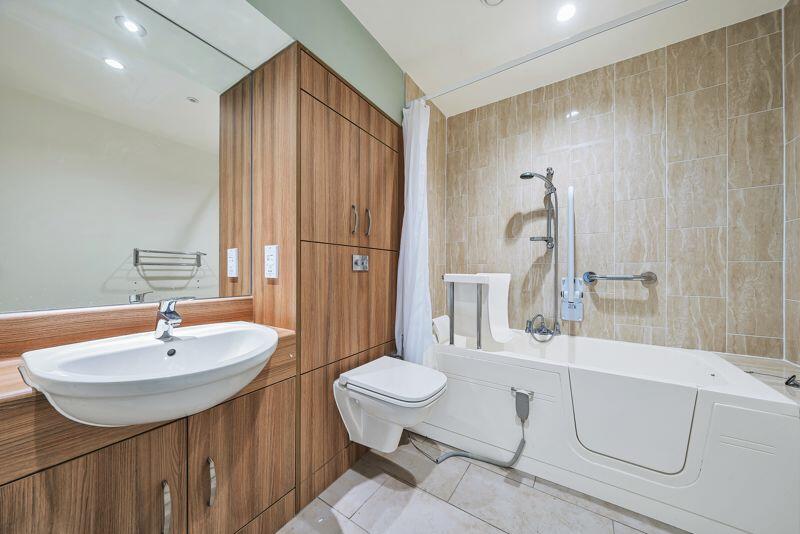 Bathroom with over-bath shower