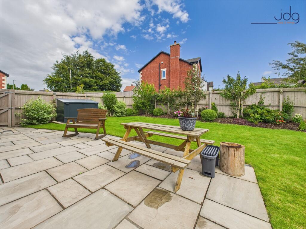 Lawn and Flagged Seating Area ¿ Neat, Practical &amp; Inviting