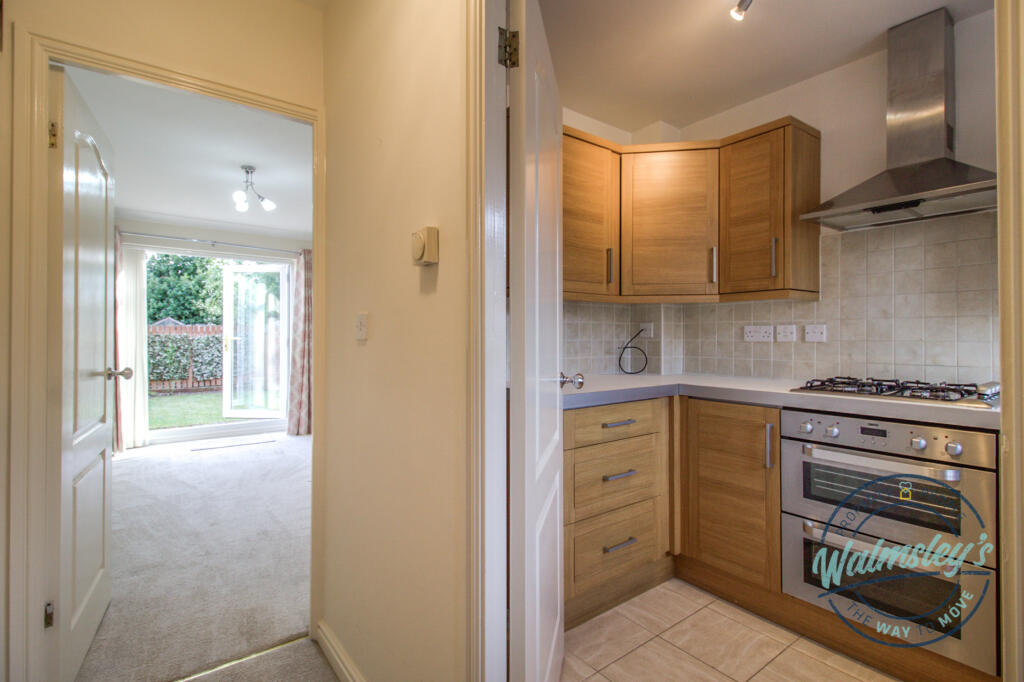 Kitchen with sitting dining room beyond