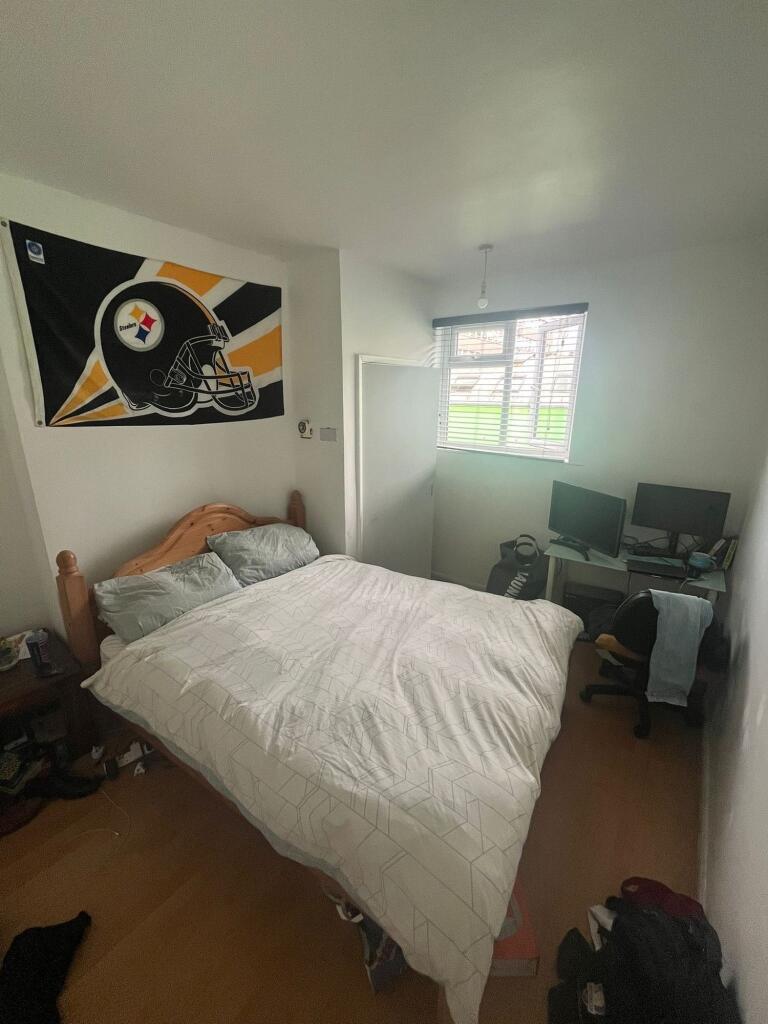 A cozy double bedroom featuring a comfortable w...