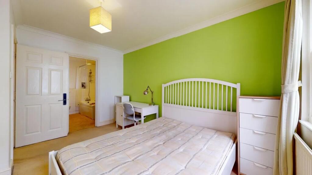 Bright and inviting master bedroom featuring a ...