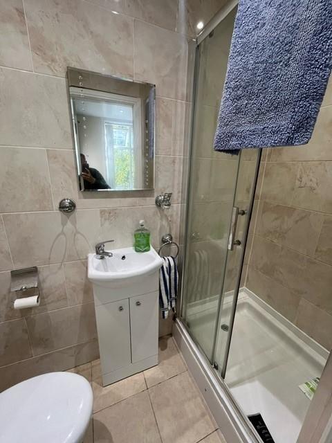 Well-presented bathroom with a modern shower en...