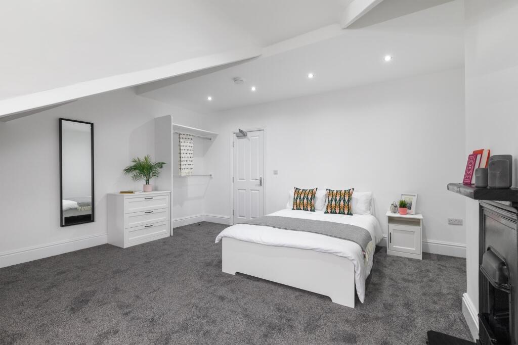 Bright, recently redecorated bedroom with neutr...