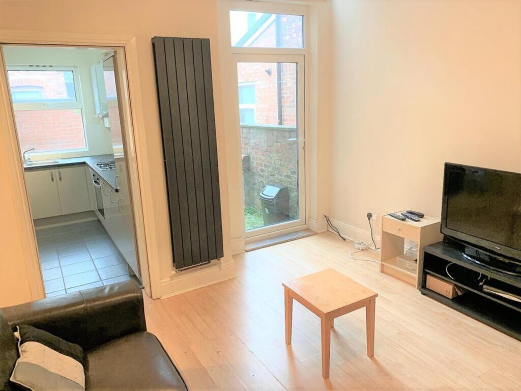 Bright and inviting living room featuring large...