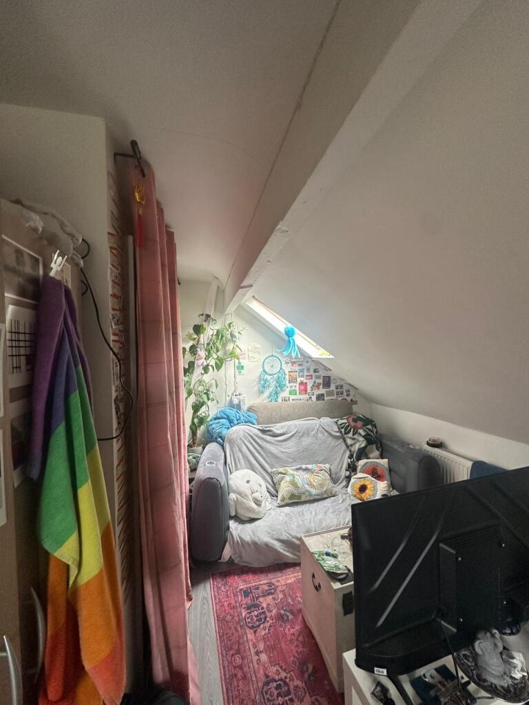 A cozy communal lounge featuring a comfortable ...