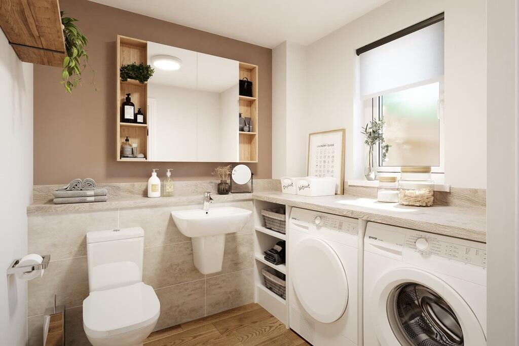 The downstairs cloakroom comes complete with utility area