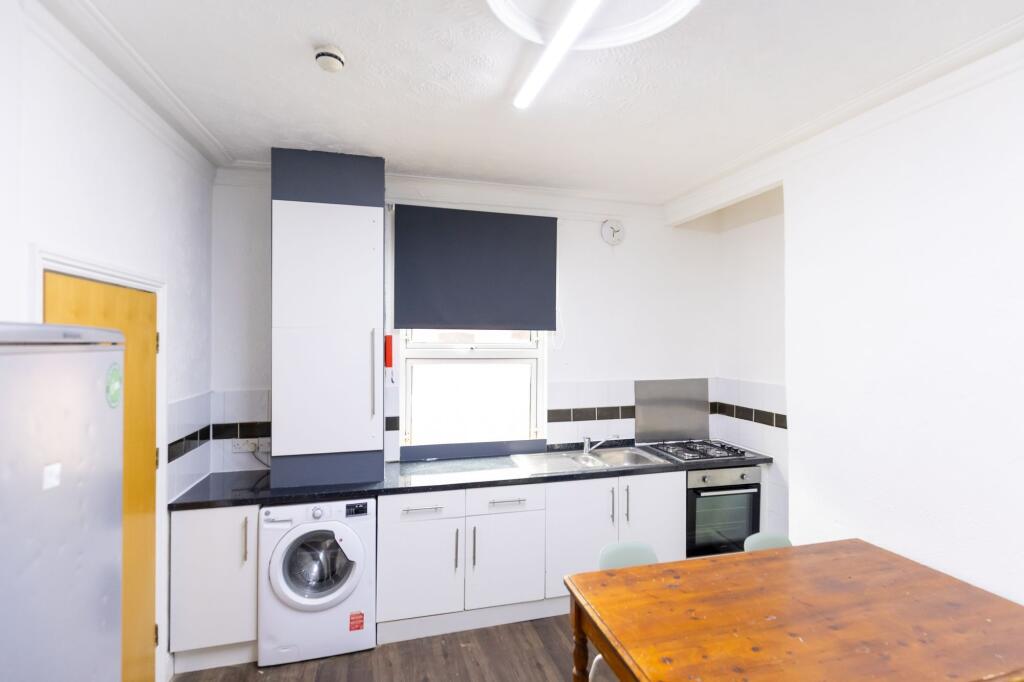 Bright and functional kitchen featuring modern ...