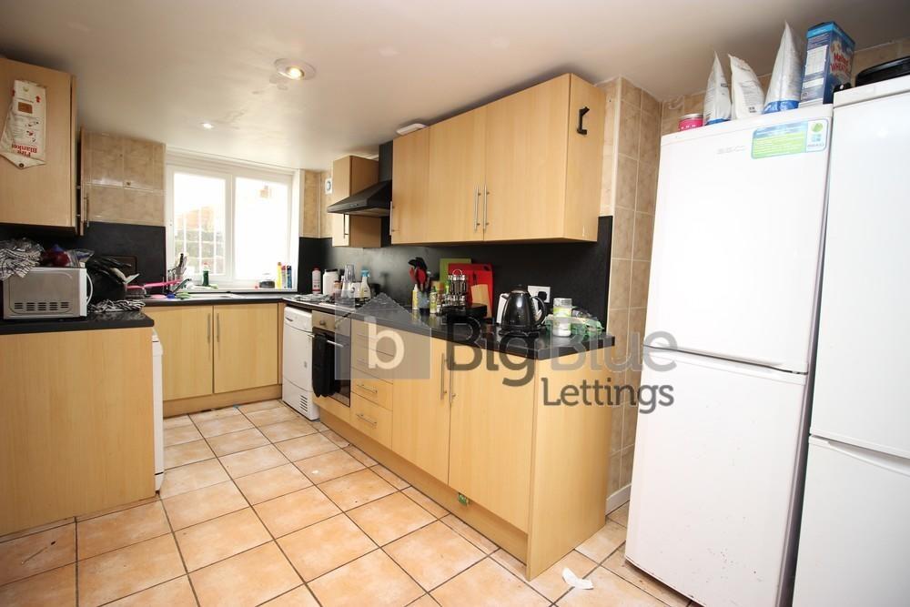 Bright and well-equipped kitchen featuring ampl...