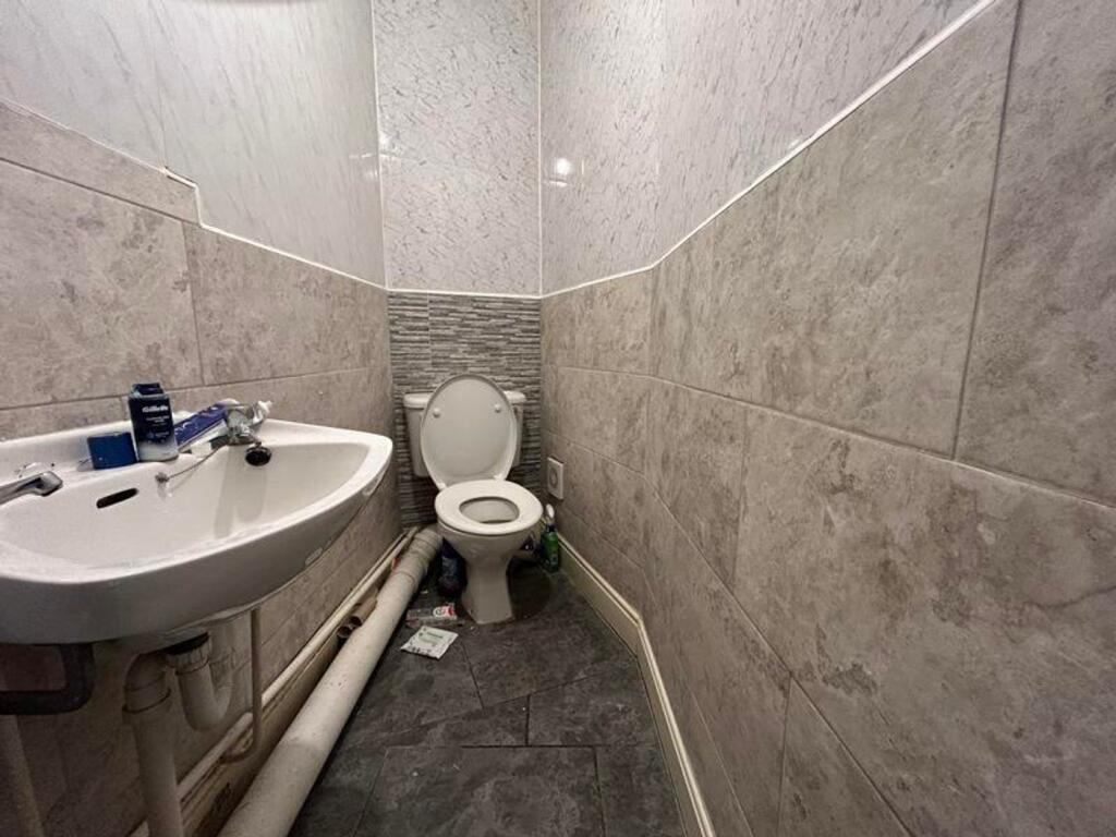 A compact single toilet featuring modern finish...