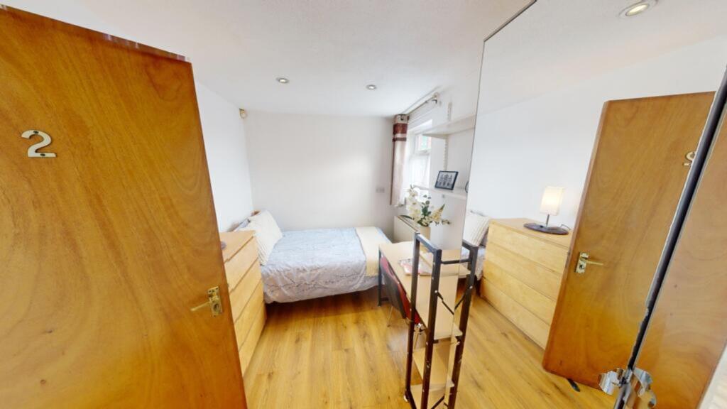 A bright and inviting double bedroom featuring ...
