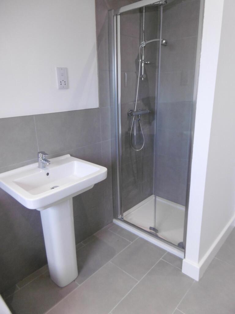 family bathroom with  shower