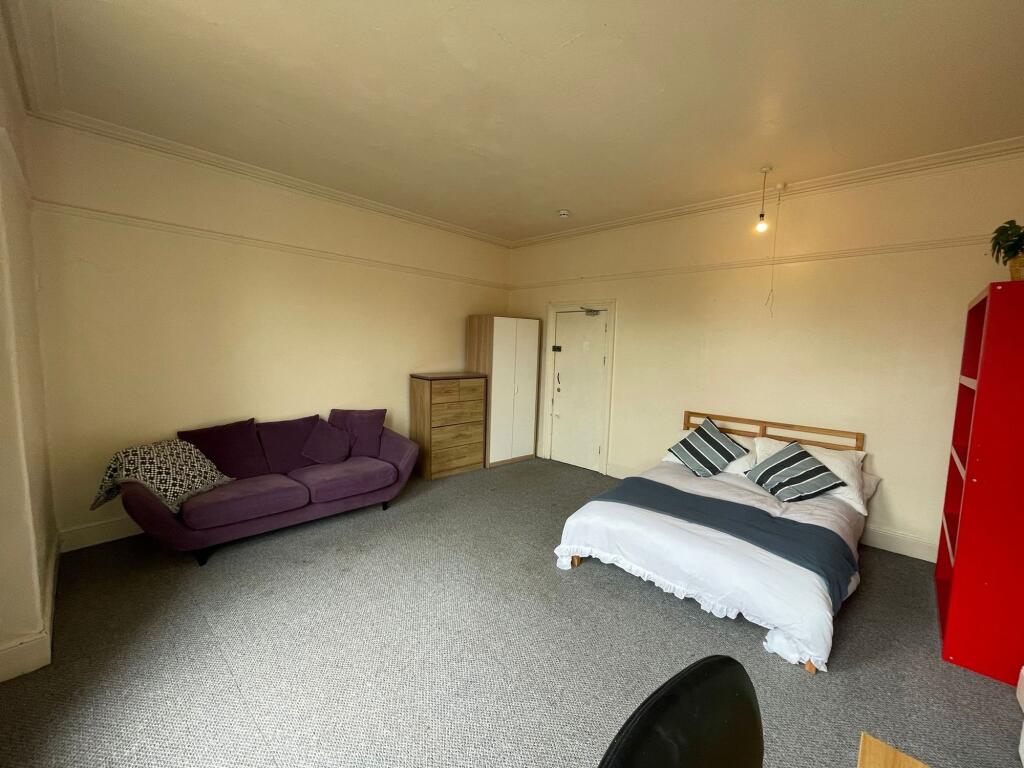 Spacious and inviting living area featuring a c...