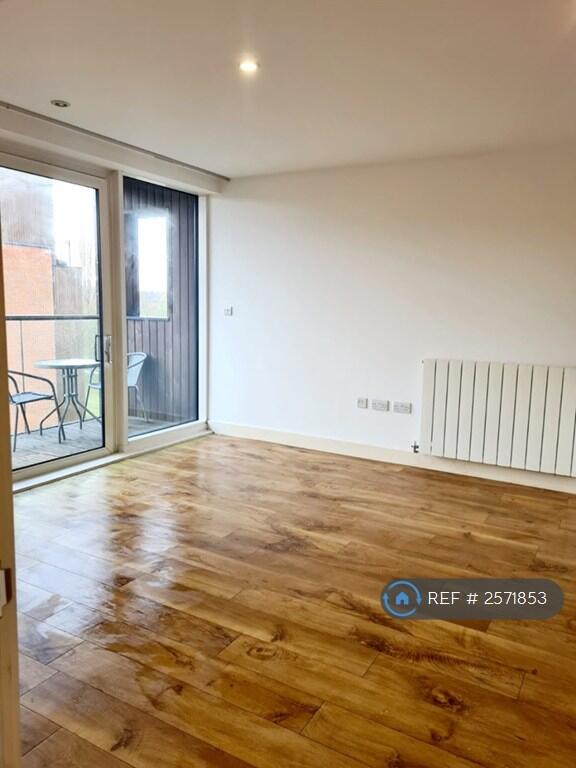 Living Space, With Floor To Celing Balcony Doors. 