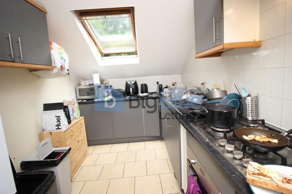 Bright and functional kitchen with modern grey ...