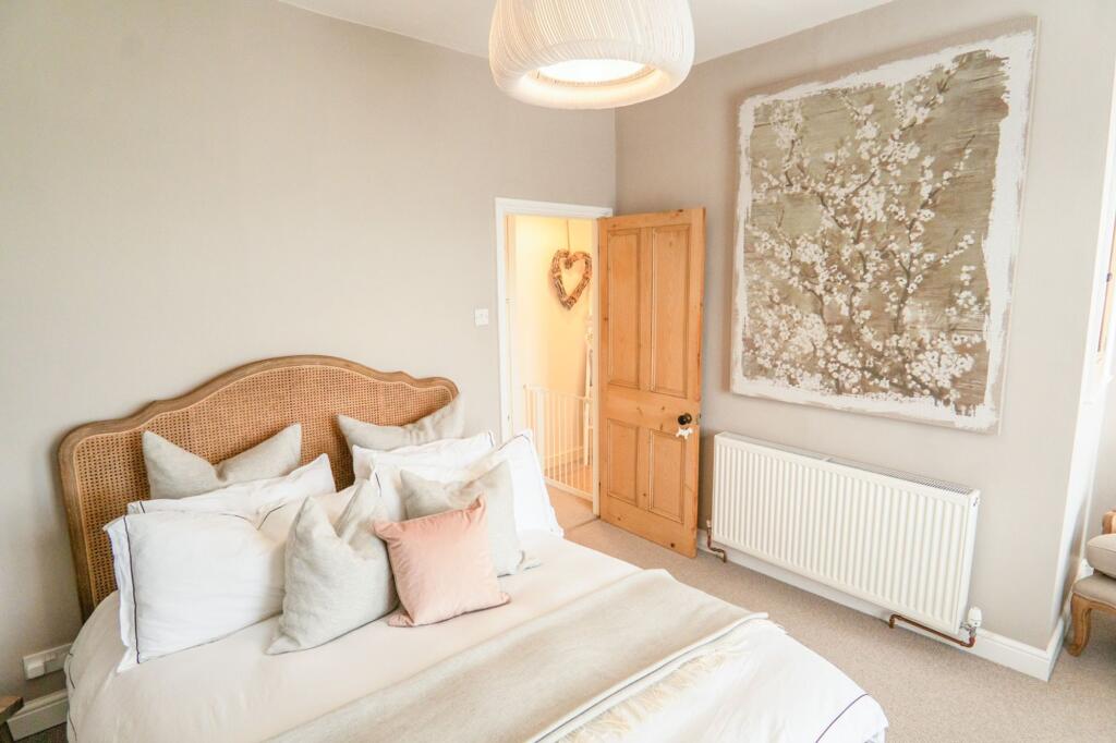 Spacious and Serene Master Bedroom