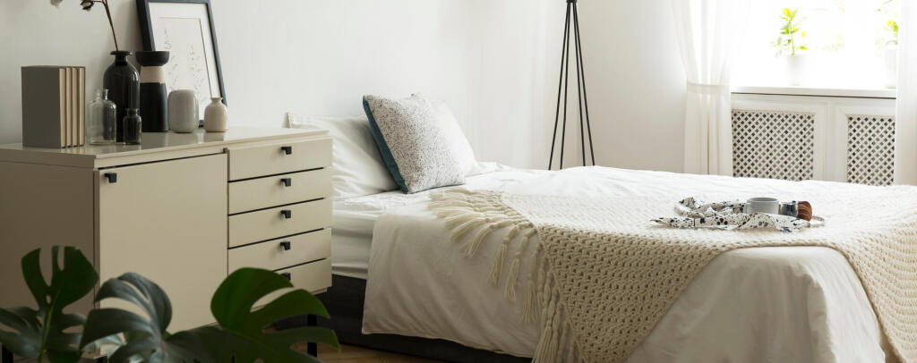 real-photo-of-bedside-table-with-books-poster-and-