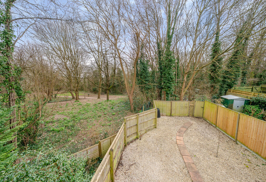 ADJOINING WOODLAND