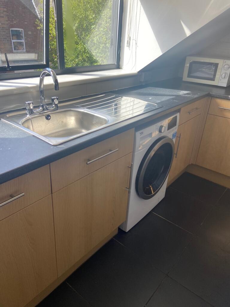 A bright and modern kitchenette featuring sleek...