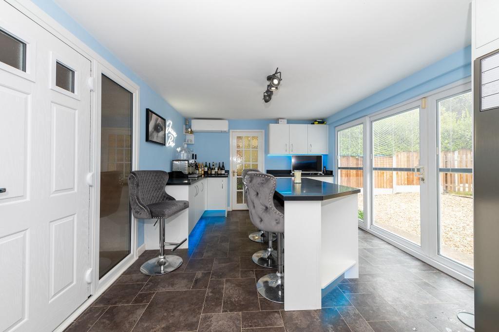 Kitchen with sliding doors to garden