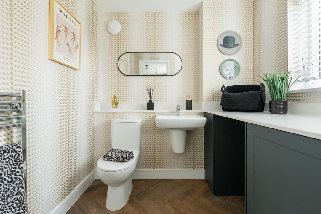A combined cloakroom and utility adds convenience