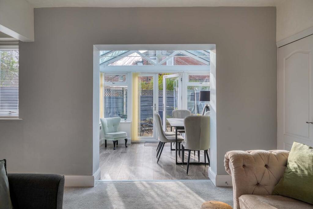 Sitting Room through to Conservatory 
