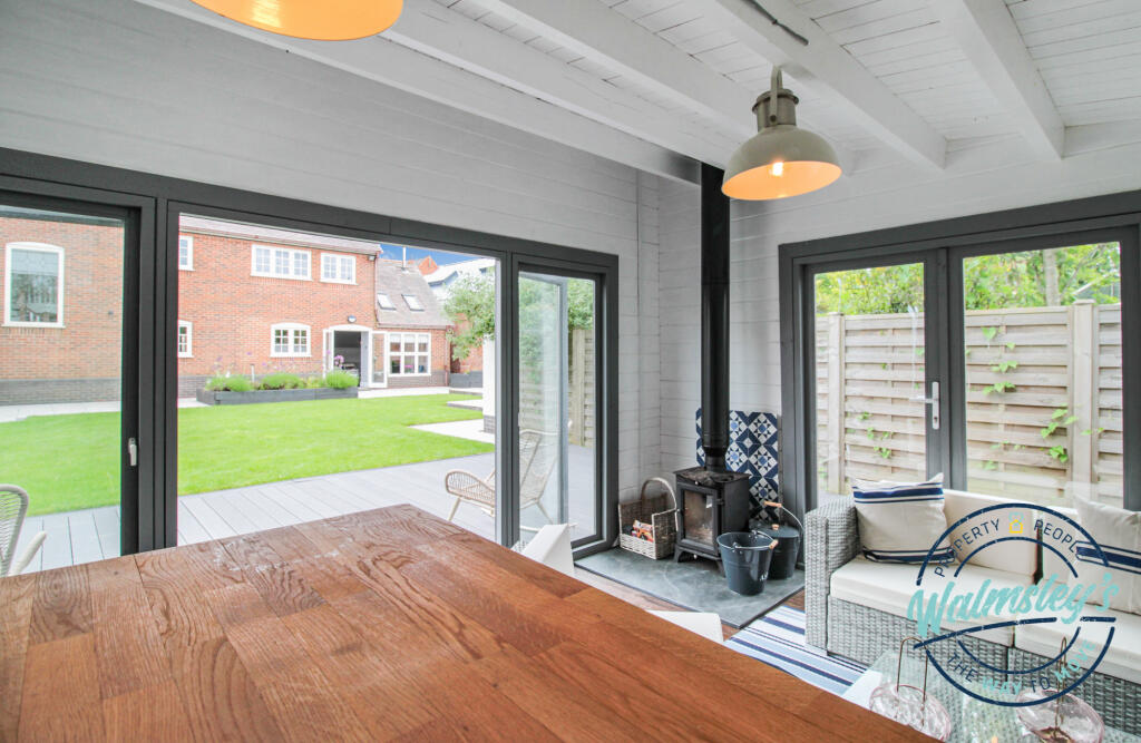 Garden cabin with log burner and bar