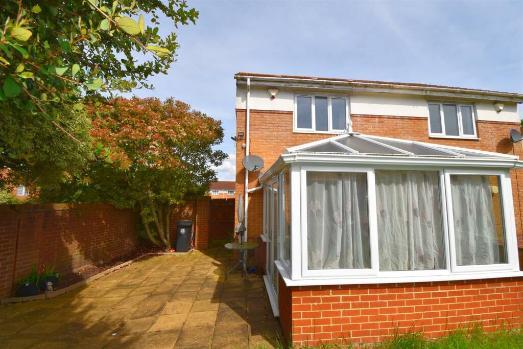 Rear view of property and patio.jpg