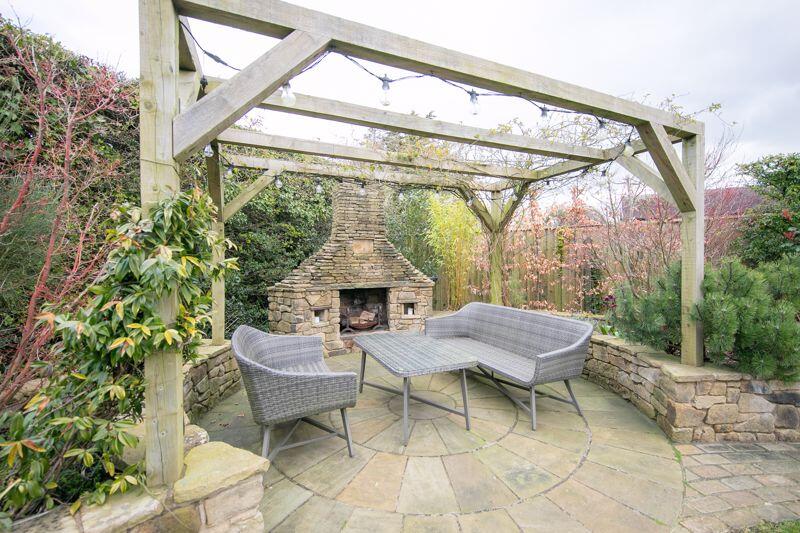 Outdoor fireplace and pergola