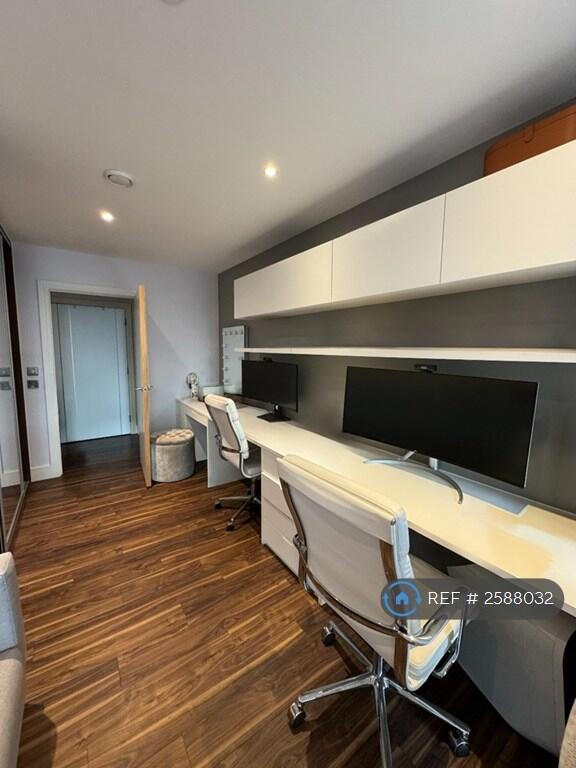 Two Workspaces With Wide Screen Monitors