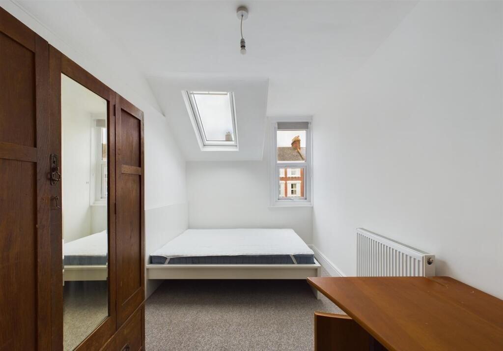 Bright and airy double bedroom featuring a larg...