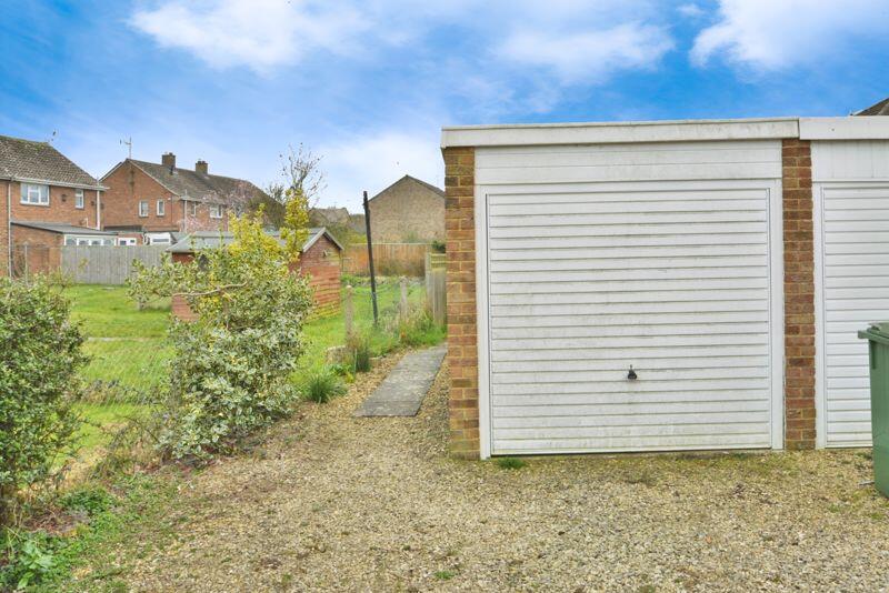 Garage and path to garden
