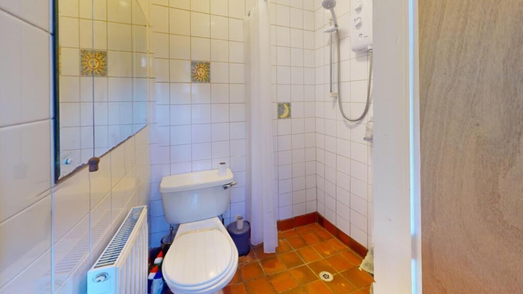 A clean and functional bathroom featuring moder...