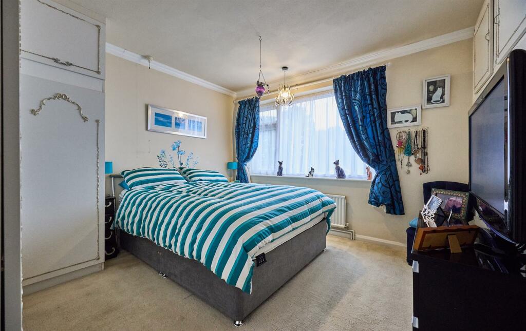 BEDROOM ONE TO FRONT