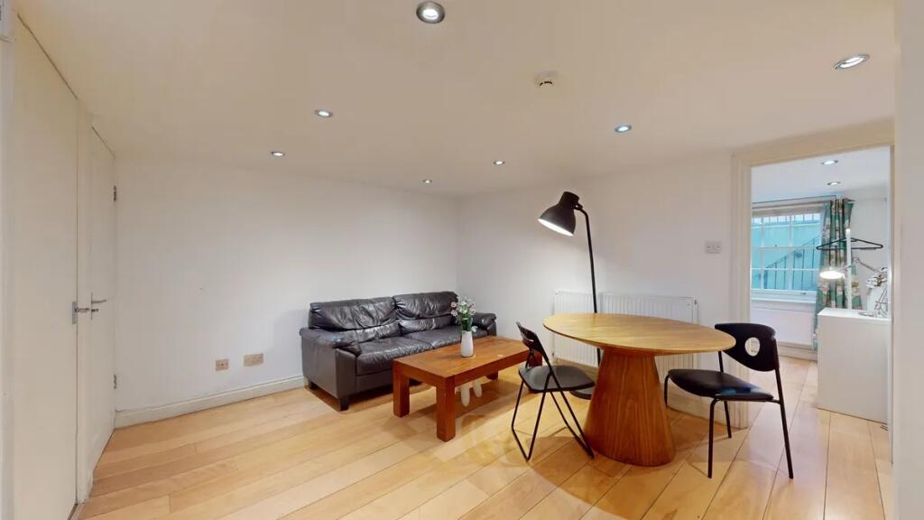 A modern living room featuring a comfortable bl...