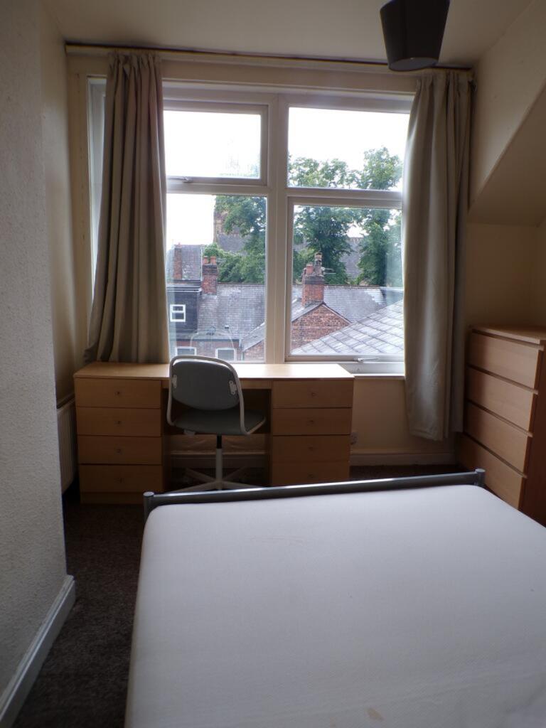 Bright and inviting double bedroom featuring la...