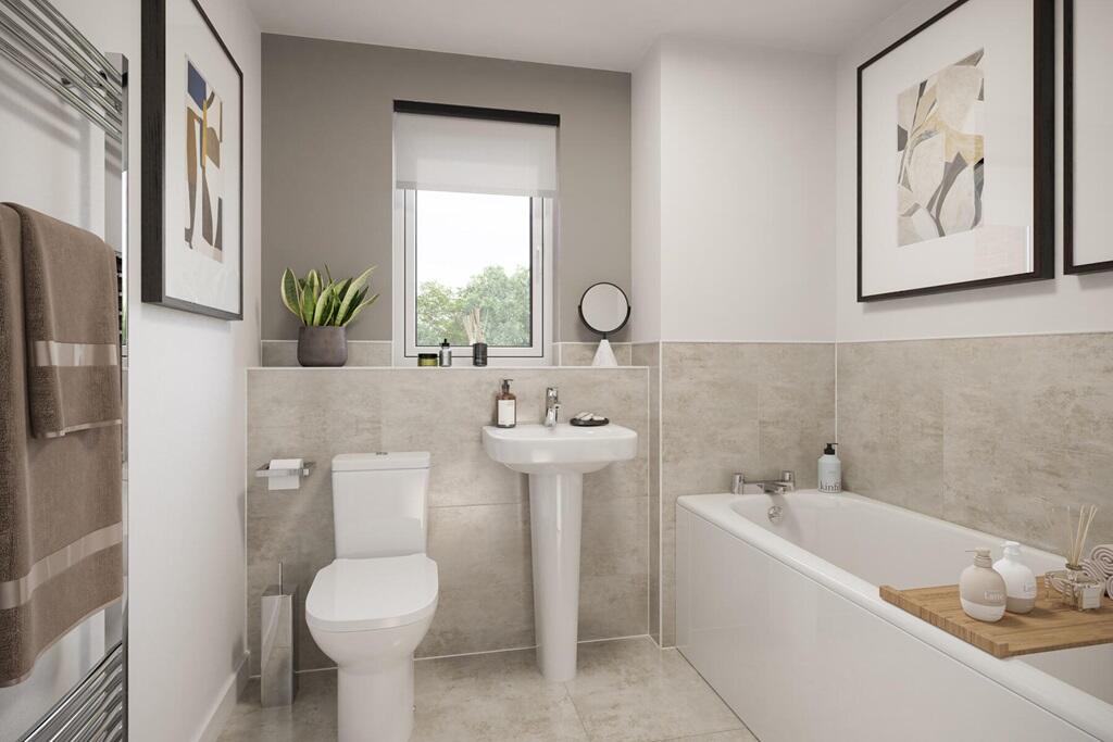 A spacious family bathroom completes the home