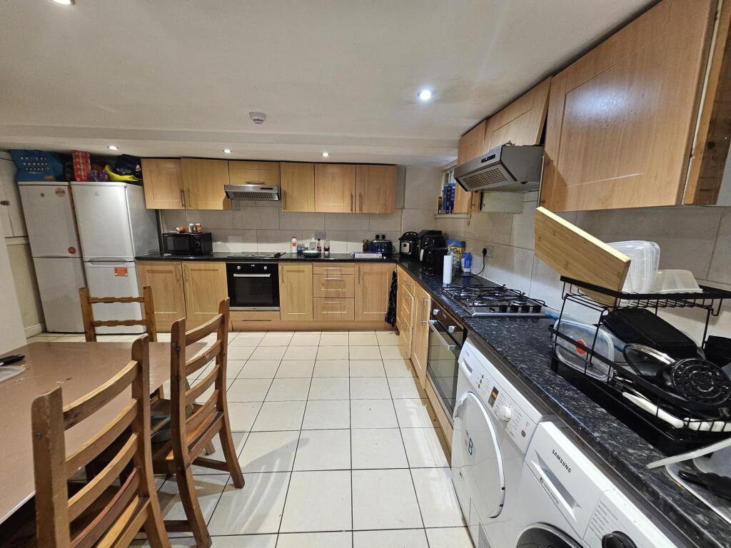 A bright and well-maintained kitchen with moder...