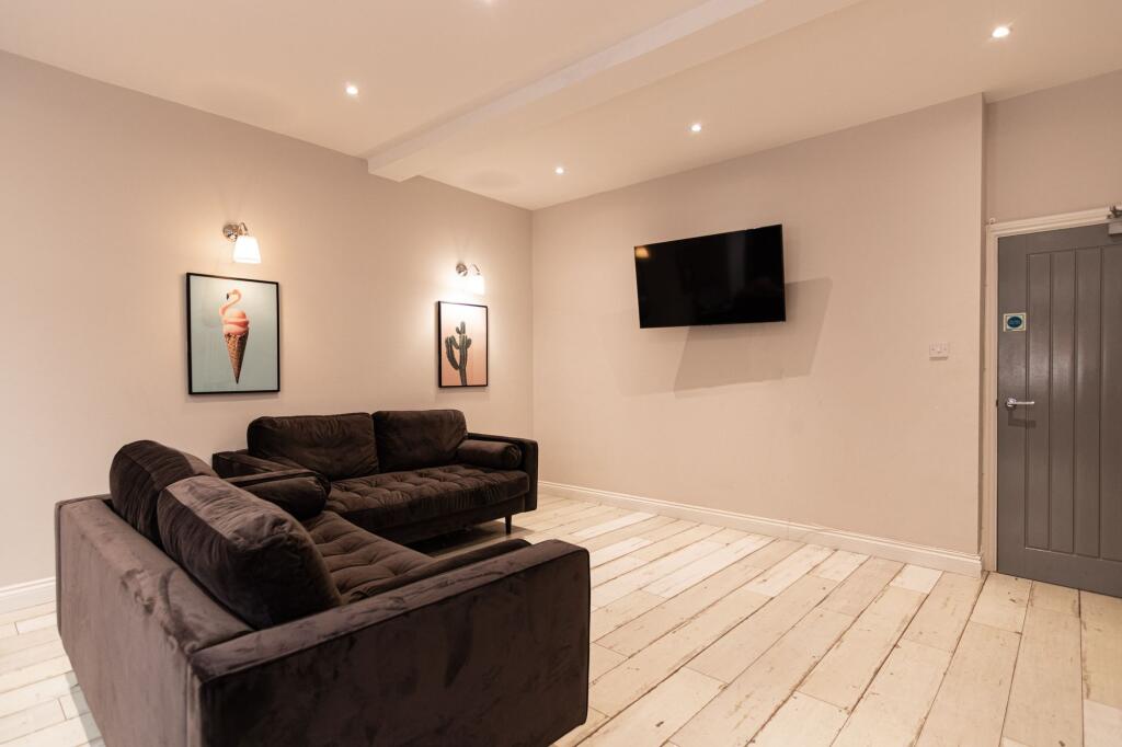 Bright, modern living room with two comfortable...